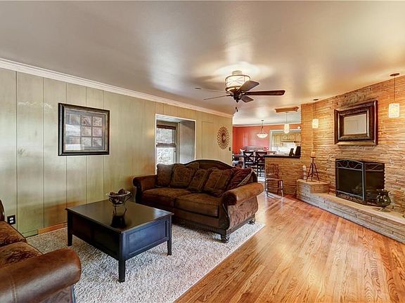 Main living room with fireplace and wet bar.