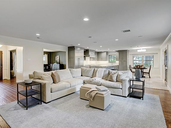 Your front entry hallway leads you inside to a spacious open concept floor plan. Plenty of natural light pours in from all sides brightening the ambience throughout.
