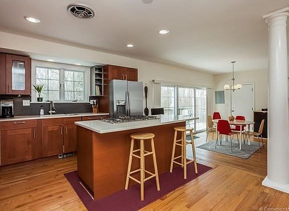 Kitchen opens to the Breakfast area and Family room.