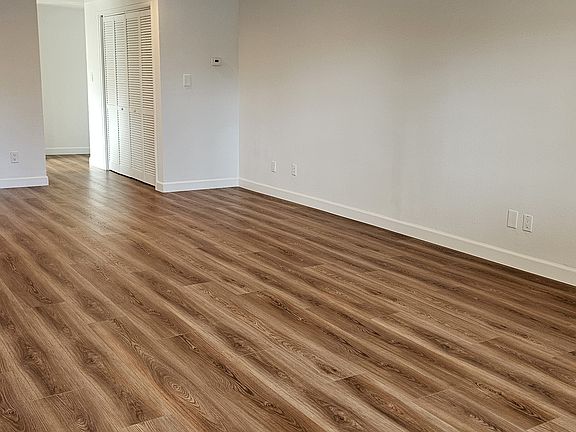 from entry door looking toward kitchen entry and laundry area hookup