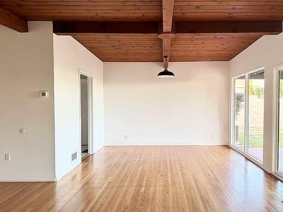 Open concept dining room that opens up to living room and overlooks the backyard.