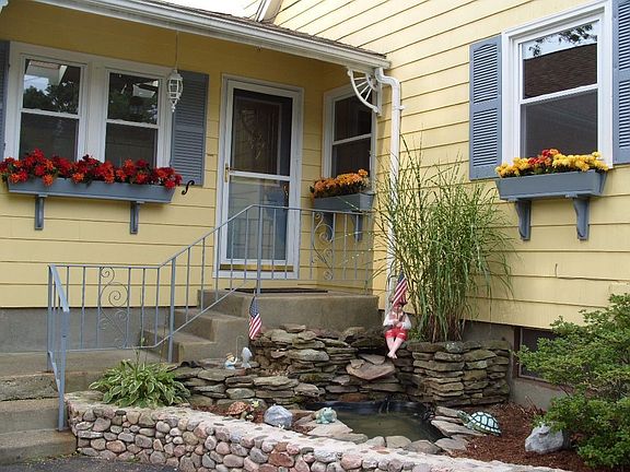 Side Entrance with Pond