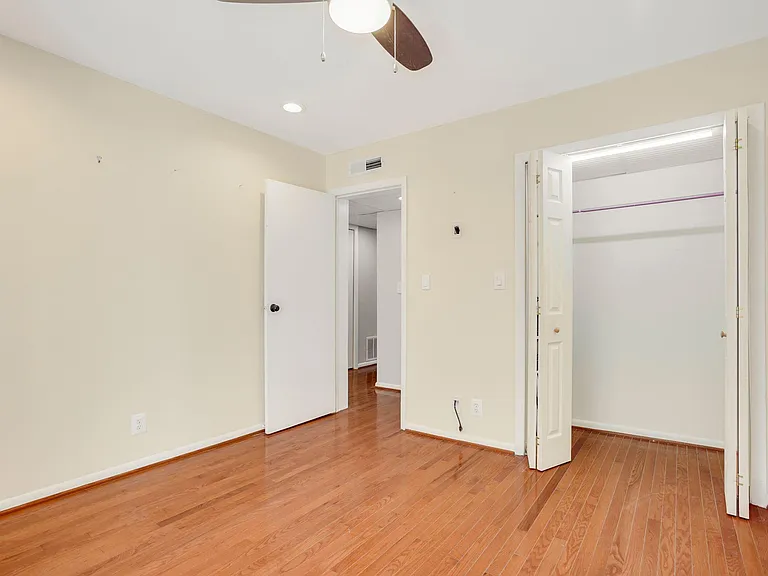 Second bedroom on top level. Closet with light. Cable for TV on the wall next to the closet. TV available.