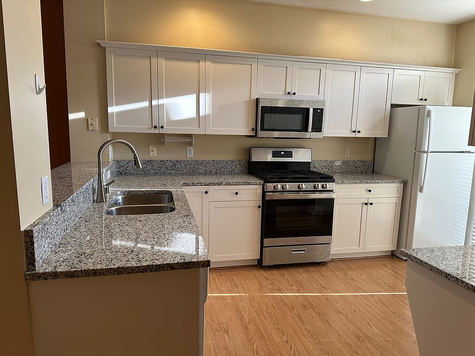 New granite countertops and freshly painted cabinets. New microwave and cooking range.