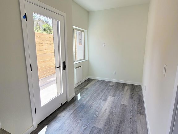 Entry level a flexible office space with attached 2 car garage.