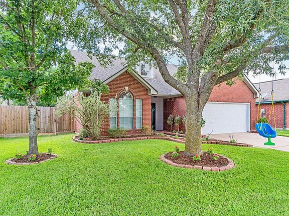 There is mature landscaping in front and back.