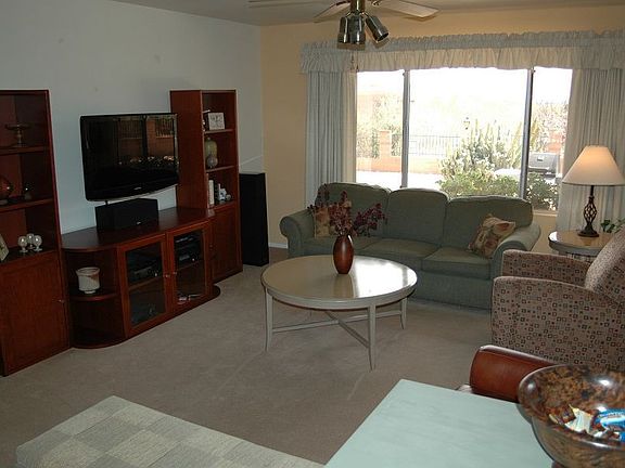 Spacious living room looks opens to the kitchen and family room