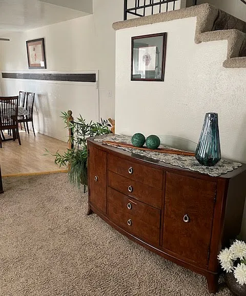 Kitchen on the left, piano on the far left, living room on the right.