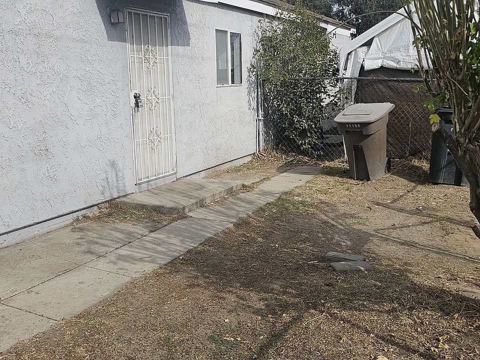 Front of apartment and part of the yard
