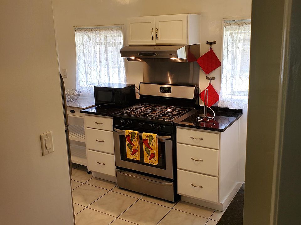 five burner stove with broiler drawer. Microwave.