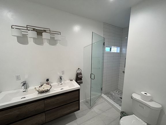 Bathroom with full bathtub and shower