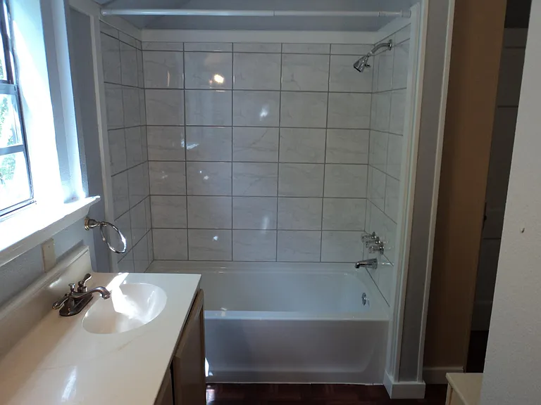 Completely remodeled shower and bathtub.