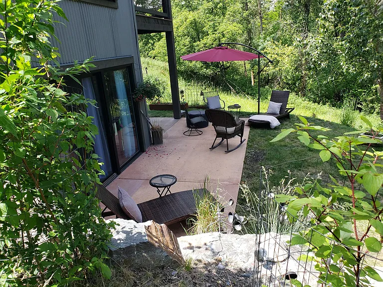 Private entertainment-sized walk-out patio/backyard with plumbed gas fire pit.