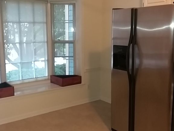 Kitchen has big, bright bay window