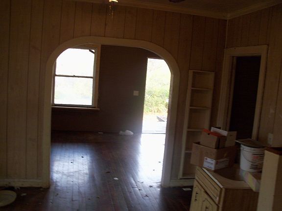 foyer from rear entrance.has paneling,could be easily painte