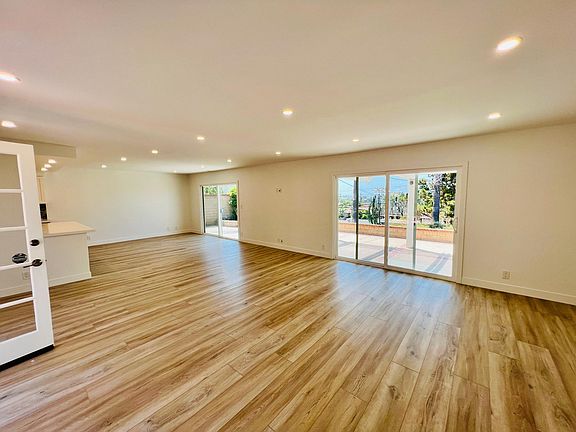 Open dining and living areas.