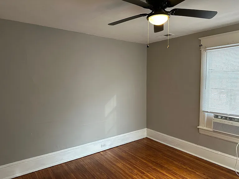 Second Bedroom w/ Designer Ceiling Fan and Two Large Windows for Natural Lighting and Closet! Newly Refinished Hardwood Floors and Designer Paint.