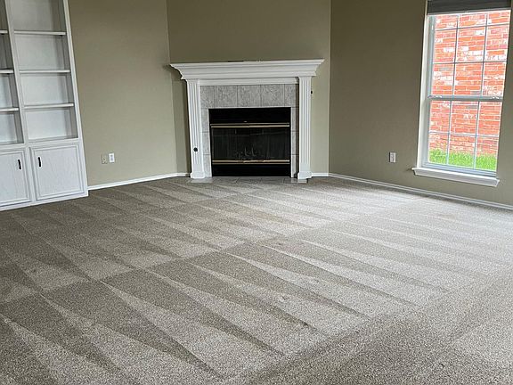 Fireplace and bookcase in living room