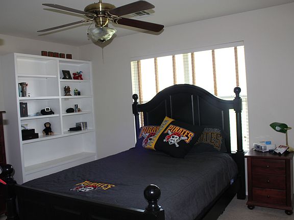 Upstair bedroom w/ built in shelving