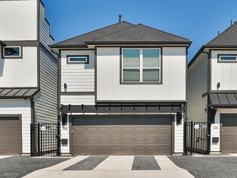 Experience sleek design with crisp white siding and sophisticated dark trim in vibrant Independence