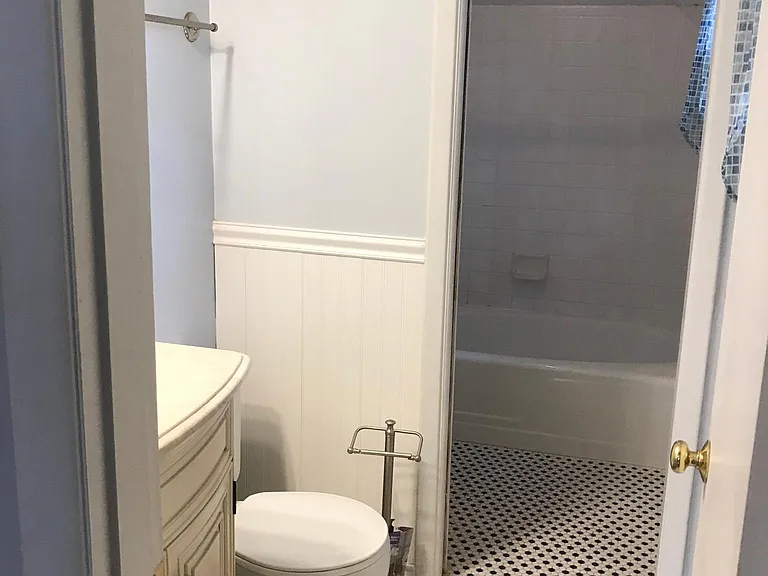 Master bath showing division into tub area where second sink is found