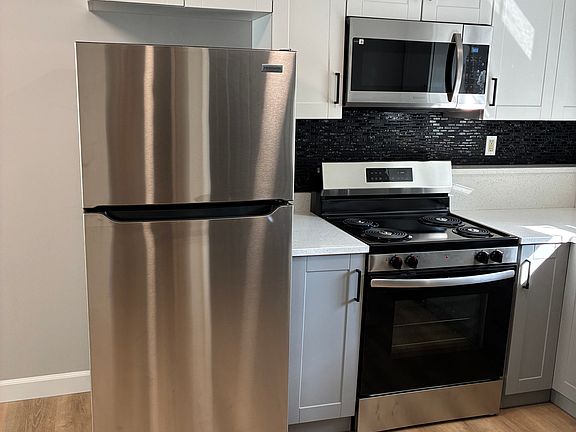 New appliances and cabinets,unit completely repainted by professional painters,Beautifully done with white ceilings and trims,black doors and grey walls!!