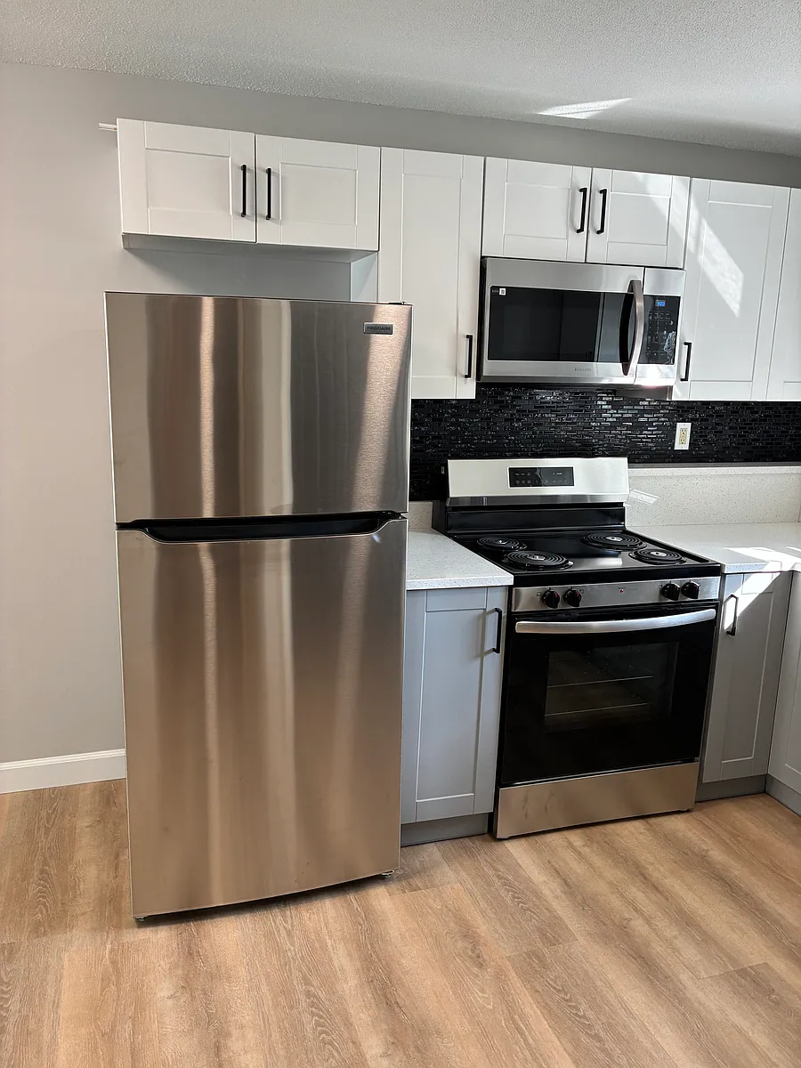 New appliances and cabinets,unit completely repainted by professional painters,Beautifully done with white ceilings and trims,black doors and grey walls!! - 160 Riviera Dr