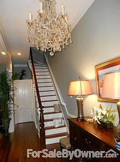Stairs to second floor : another chandelier is at the top of the stairs