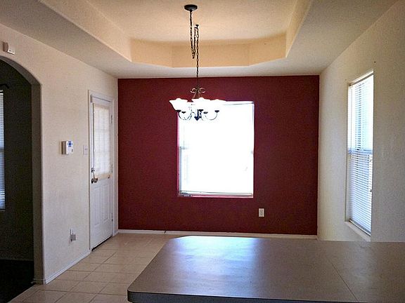 Breakfast bar and dining area over look back yard and even get views of the lake!