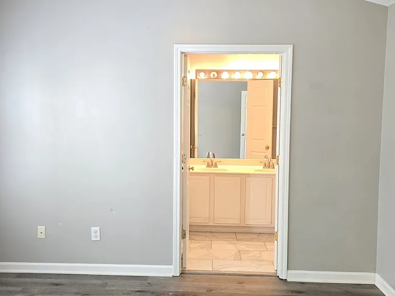 master bedroom with master bathroom