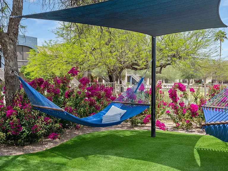 Recline in our hammocks nestled beside the pool, basking in ultimate relaxation within our vibrant outdoor sanctuary.