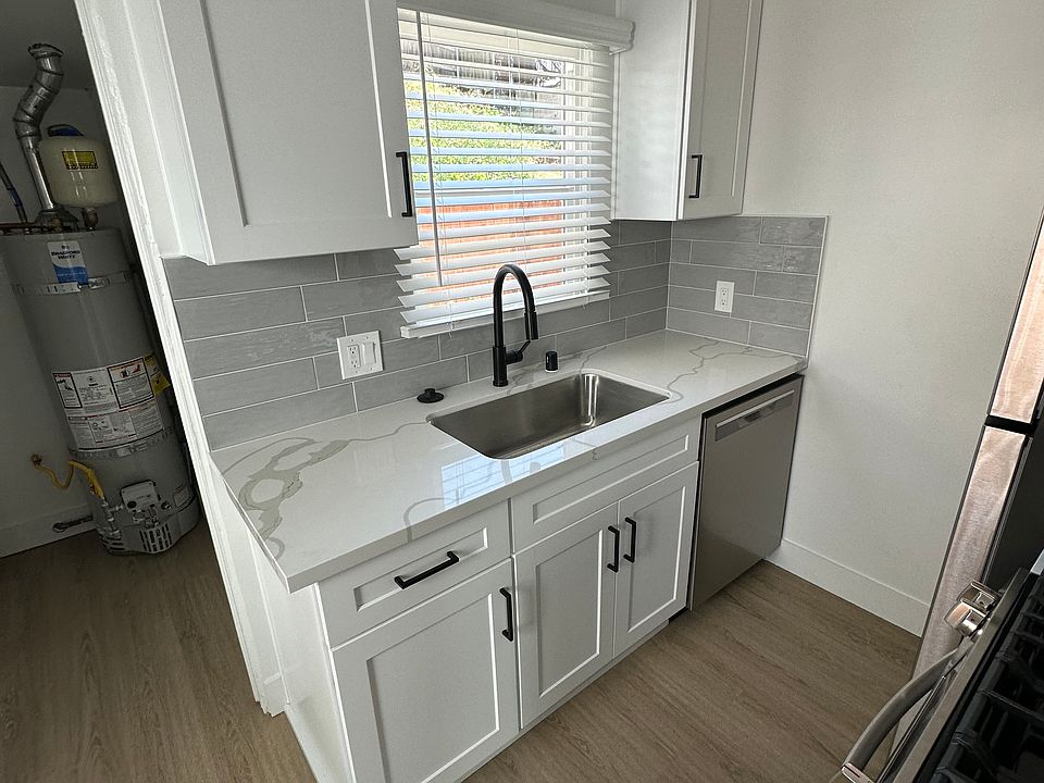 New cabinets, sink, dishwasher, backsplash.