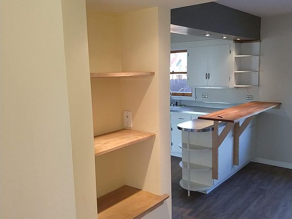 Built in bookcases between dining area and living room