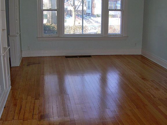 View of the living room and picture window unfurnished.