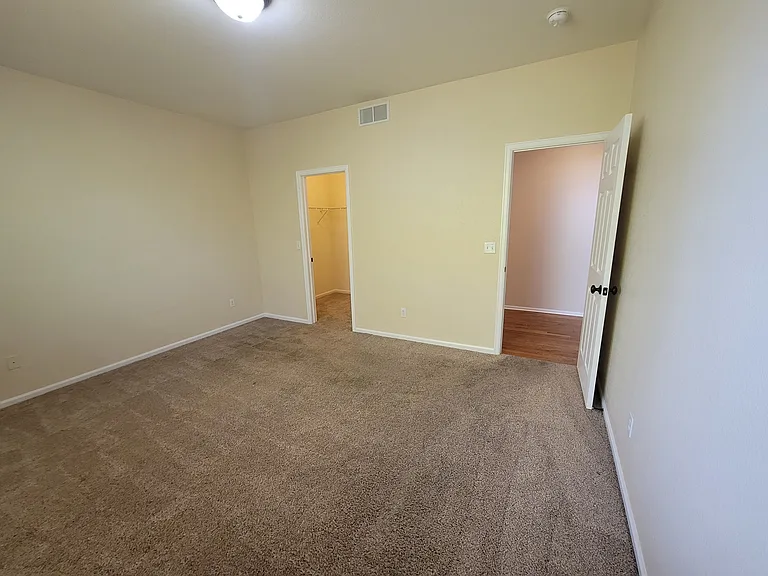 bedroom on main level with walk in closet