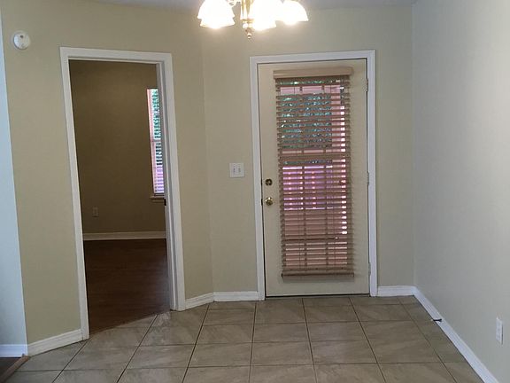 View from kitchen to MBR and screened breezeway to deck, fen