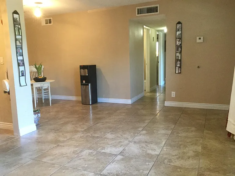Living room towards the hallway with2 closets for storage.