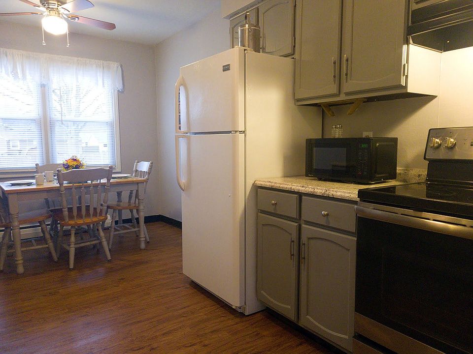 Kitchen with full size refrigerator / freezer, stove and microwave