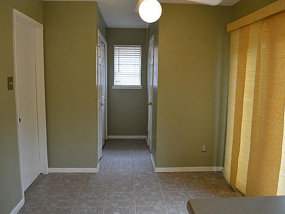 Closer look at breakfast room which has a sliding glass door going to backyard.