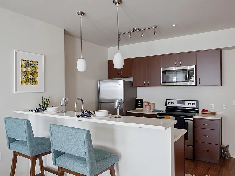 Grant Park Village kitchen shot with bar and blue bar stools