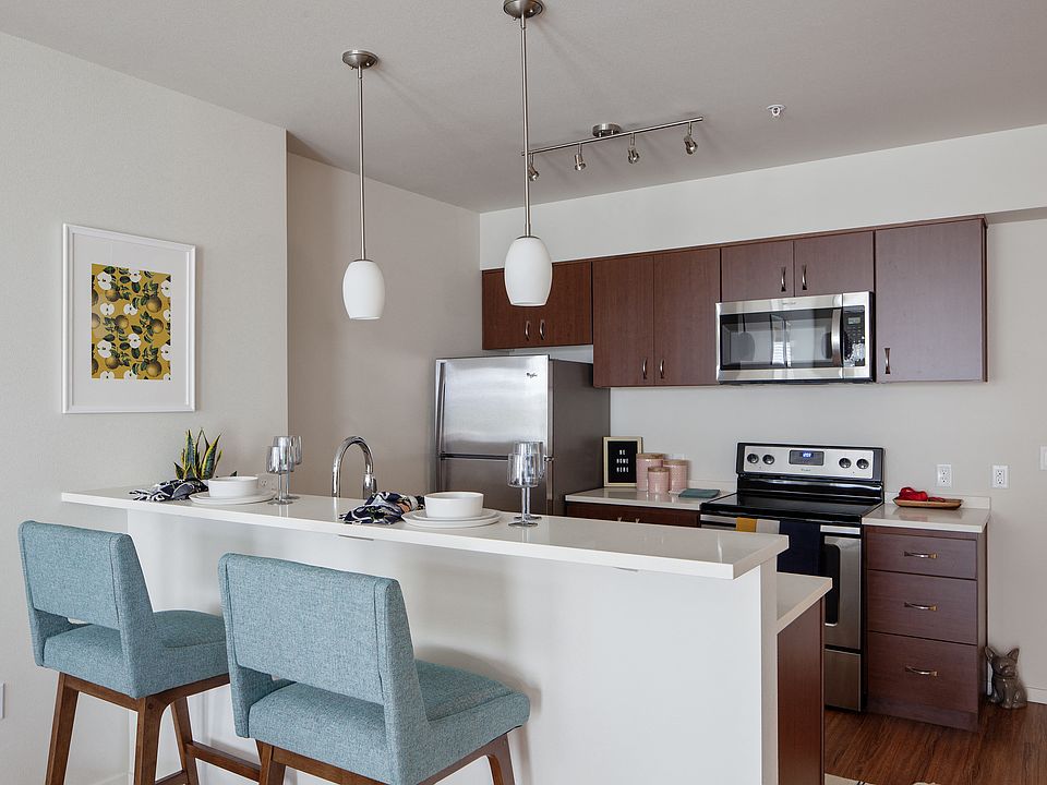 Grant Park Village kitchen shot with bar and blue bar stools