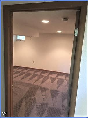 This bedroom/ tv room is in the basement and has brand new carpet