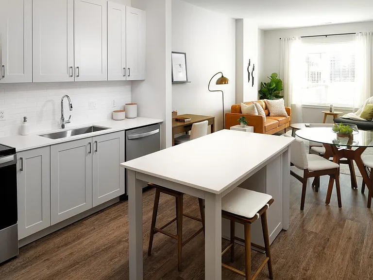 Design Collection II Kitchen with grey shaker cabinetry, white tile backsplash, white quartz countertops, and stainless steel appliances (Representative photo)