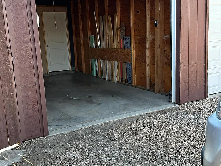 Single car garage for storage or to park a car in. Additional parking is available in front as well