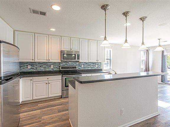 4th image of 18731 E 58th Avenue #A
