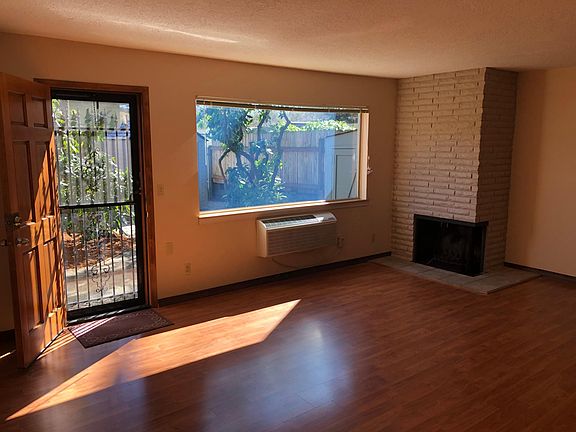 Fireplace and A/c. New plank flooring, large window overlooks your yard.