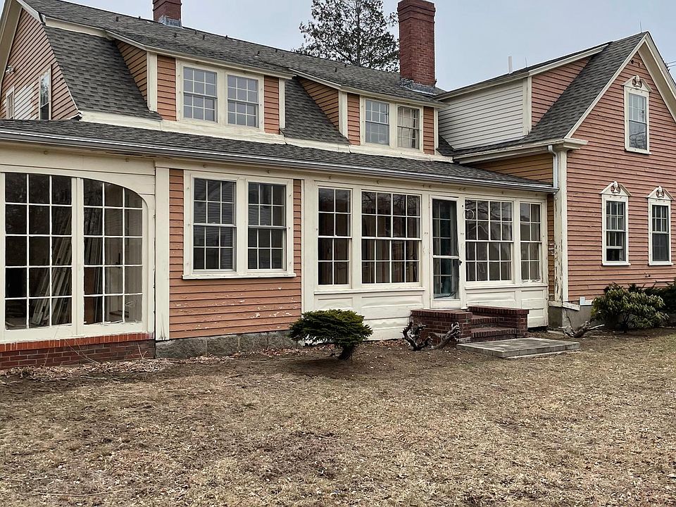 Side of home showing florida room and sun filled private office.