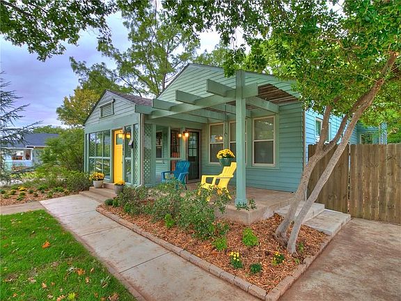 Front patio with pergola, new sidewalks and driveway