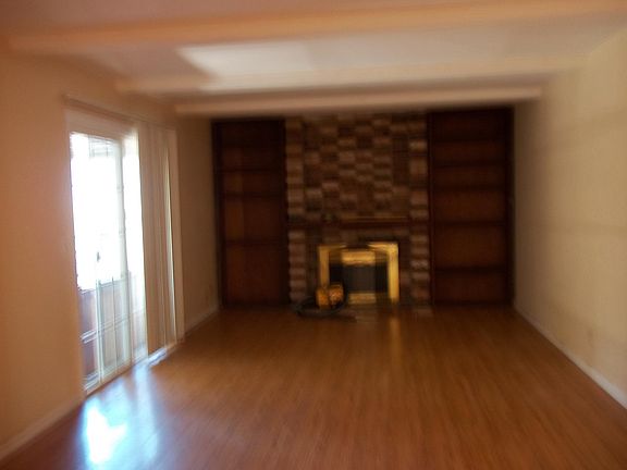 Family Room with slider to back yard and hot tub.