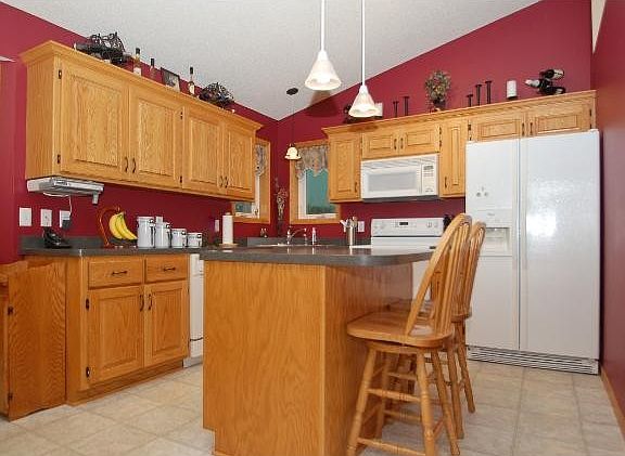 Kitchen filled w Custom Cabinetry